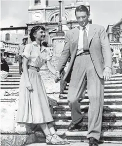  ??  ?? Audrey Hepburn and Gregory Peck enjoy their outing on the Spanish Steps in the 1953 romantic comedy Roman Holiday.