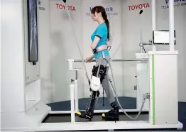  ?? — PTI ?? The Toyota Welwalk WW-1000 system is a wearable robotic leg brace designed to help partially paralyzed people walk. The patients can practise walk wearing the robotic device on a special treadmill that can support their weight.