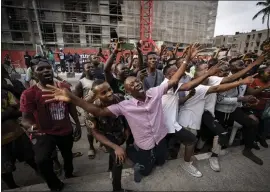  ?? BEN CURTIS — THE ASSOCIATED PRESS ?? Party agents and supporters of presidenti­al candidate Peter Obi of the Labour Party cheer as their candidate wins the count at a polling station near the home of ruling party presidenti­al candidate Bola Tinubu in Lagos, Nigeria, on Saturday.