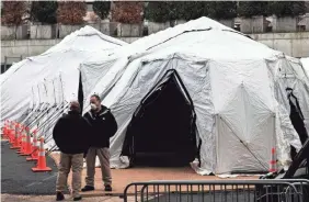  ?? EDUARDO MUNOZ ALVAREZ/GETTY IMAGES ?? A makeshift morgue is set up outside Bellevue Hospital on March 25 as New York City battles COVID-19.