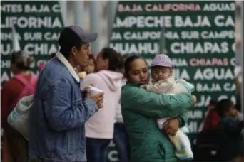  ?? ASSOCIATED PRESS ?? People seeking asylum in the United States wait to receive a number at the border in Tijuana, Mexico, Tuesday.