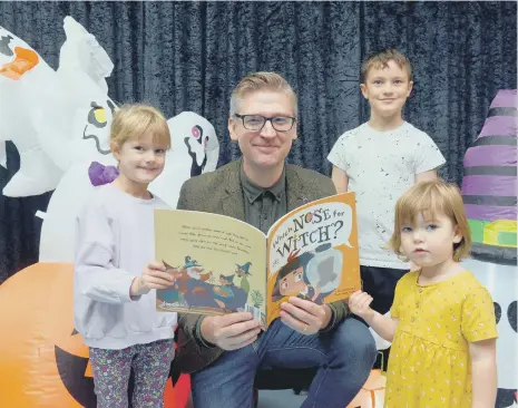  ?? ?? Author David Crosby with his latest book, Which Nose for Witch, at the Bridges haunted grotto with children James, 9, Emily, 5 and Bethany Russell, 2.