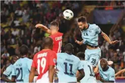  ??  ?? MONACO: Porto’s Brazilian defender Felipe (2nd-R) heads the ball during the UEFA Champions League Group G football match AS Monaco FC vs FC Porto yesterday at the Louis II stadium in Monaco. — AP