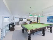  ??  ?? A mezzanine floor is home to a snooker table