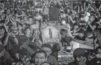  ?? VIVEK PRAKASH/GETTY-AFP ?? Thais protest: Tens of thousands of demonstrat­ors defied police warnings and occupied a historic field in Thailand’s capital Saturday to support a student-led protest movement for new elections and reform of the monarchy. Organizers had predicted that as many as 50,000 people would take part in the protest at Sanam Luang.