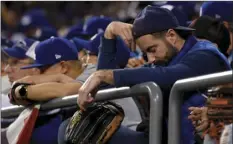  ?? AP
PHOTO/MARK J. TERRILL ?? Los Angeles Dodgers fans watch during the ninth inning of Game 7 of baseball’s World Series against the Houston Astros Wednesday in Los Angeles.