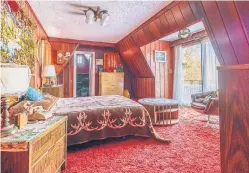  ??  ?? RETRO FIT: Bold wall-to-wall shag carpeting covers most of the three-bedroom house, including the wood-paneled main bedroom.