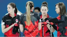  ?? NATACHA PISARENKO/THE ASSOCIATED PRESS ?? The Ottawa rink of Lisa Weagle, left, Emma Miskew, Joanne Courtney and skip Rachel Homan was still looking for its first victory after three games at the Olympics.
