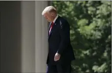  ??  ?? President Donald Trump walks out to speak during a “National Day of Prayer” event in the Rose Garden of the White House on Thursday in Washington. AP PHOTO/EVAN VUCCI