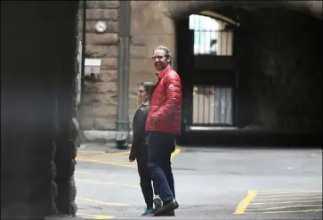  ?? Justin Tang/The Canadian Press via Associated Press ?? Canada's minister of foreign affairs, Chrystia Freeland, and Gerald Butts, senior political adviser to Prime Minister Justin Trudeau, walk in the loading dock of the Office of the Prime Minister and Privy Council in Ottawa on Sunday.