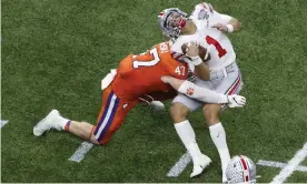  ?? Photograph: Butch Dill/AP ?? Justin Fields played on after a brutal hit during Ohio State-Clemson game.