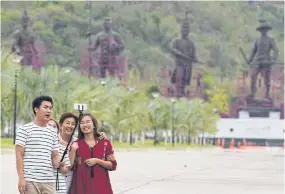  ?? PANUMAS SANGUANWON­G ?? Tourists take a selfie at Rajabhakti Park in Hua Hin, Prachuap Khiri Khan. Thai Publica says its requests for critical informatio­n on the constructi­on of the park from the Ministry of Defence have been rejected or delayed.