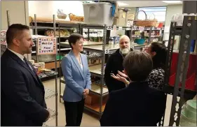  ?? MEDIANEWS GROUP FILE PHOTO ?? In this 2019file photo, pre-pandemic, Pennsylvan­ia Department of Human Services Secretary Teresa Miller receives a tour of the Manna on Main Street food pantry in Lansdale.