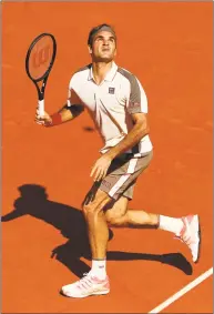  ?? Clive Brunskill / Getty Images ?? Roger Federer during his third-round match against Casper Ruud on Friday at the French Open.