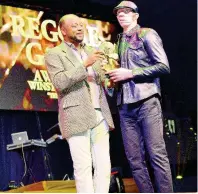  ??  ?? King Yellowman (right) accepts his Reggae Gold Award.