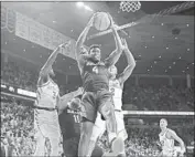  ?? Matthew Putney Associated Press ?? MARIO KEGLER grabs one of his six rebounds in Baylor’s 73-69 victory over No. 19 Iowa State.