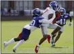  ?? FRANK FRANKLIN II — THE ASSOCIATED PRESS ?? Giants’ Sterling Shepard catches a pass despite Janoris Jenkins’ efforts during practice Thursday in East Rutherford, N.J.