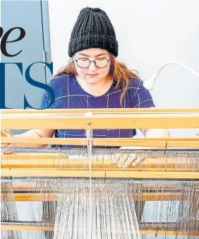  ?? ELYCIA SFA ?? Textile artist and OCADU grad Elycia SFA creating at her loom.