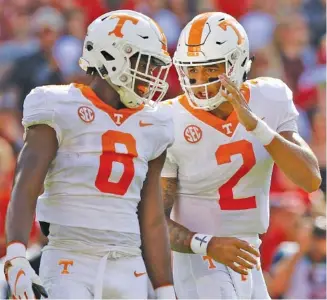  ?? STAFF FILE PHOTO BY C.B. SCHMELTER ?? Tennessee quarterbac­k Jarrett Guarantano (2) talks with running back Ty Chandler between plays during the Vols’ game at Georgia last September. Guarantano is likely to hold on to his starting spot this summer.