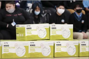  ?? MATT ROURKE — THE ASSOCIATED PRESS FILE ?? Boxes of KN95protec­tive masks are stacked together before being distribute­d to students at Camden High School in Camden, N.J.