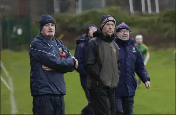  ??  ?? PJ Morrissey, Michael Anthony O’Neill andWicklow Senior hurlingman­ager Seamus Murphy watch on during the Wicklow v Meath challenge game in Bray recently.