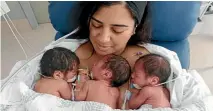  ??  ?? Triplets, from left, Sameer, Elia, and Rumi, with mum Dina Wahid in Wellington Hospital after being born on Christmas Day.