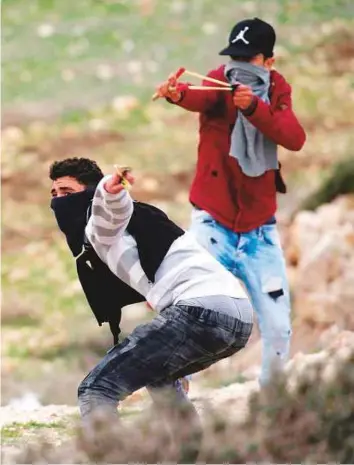  ?? AFP ?? Palestinia­ns clash with Israeli occupation forces in the West Bank village of Madama after Israelis from Yitzhar colony reportedly attacked the southern side of the village.