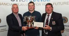  ??  ?? Up to scratch: Winner Caolan Rafferty (Dundalk) receives the Dundalk Scratch Cup from Martin McDonnell (One Finance) and Gerry Byrne, Captain, Dundalk Golf Club