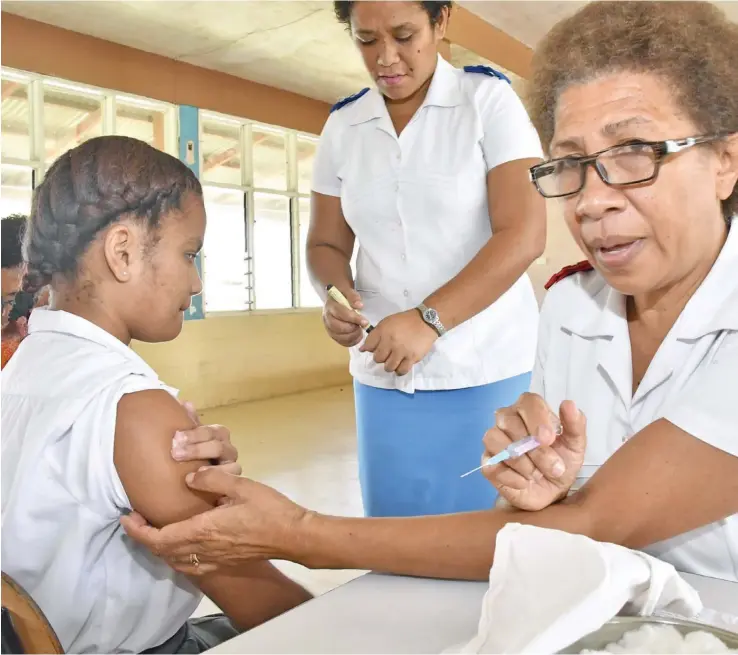  ?? Photo: DEPTFO News ?? Government will continue with the free medicine scheme to assist low income households. A student getting a Meningococ­cal vaccinatio­n by Sister Ana Seru during the National Immunisati­on Campaign for Meningococ­cal that is ongoing.