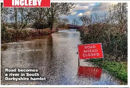  ??  ?? Road becomes a river in South Derbyshire hamlet