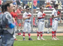  ??  ?? The Regis Jesuit Raiders and the Cherry Creek Bruins line up for the National Anthem before playing the Colorado State 5A Championsh­ip in 2019.