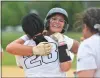  ?? KYLE FRANKO/ TRENTONIAN PHOTO ?? Burlington Township’s Taylor Fitzpatric­k, back, hugs teammate Camille Morgan, front, after Fitzpatric­k hit a solo home run in the sixth inning against Delsea during the South Jersey Group
III softball sectional final on Thursday afternoon in Burlington.