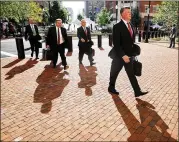  ?? CHIP SOMODEVILL­A / GETTY IMAGES ?? Jay Nanavati (left), Richard Westling, Thomas Zehnle and Kevin Downing, attorneys for ex-Trump campaign chair Paul Manafort, arrive at court Tuesday for the 11th day of Manafort’s trial in Alexandria, Virginia. Manafort is charged with bank and tax fraud.