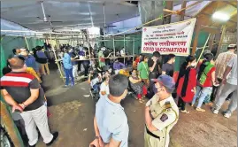  ??  ?? People line up for vaccinatio­n at Nursing College Centre in Thane on Thursday.