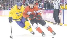  ?? WINSLOW TOWNSON, USA TODAY SPORTS ?? Jonathan Toews, right, scored Canada’s first goal Sunday.