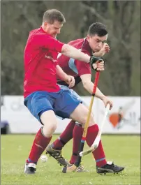  ?? Photograph: Donald Cameron. ?? Ballachuli­sh’s Stuart Carmichael gets his block in on Josh Fraser of Strathglas­s during their Camanachd Cup first round tie.