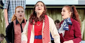  ??  ?? The vocal performanc­es of (from left) Tessa Martin, Bridie Turner as “Kim Macafee” and Clare Turner were highlights of Chairo Christian School’s production “Bye. Bye Birdie”.