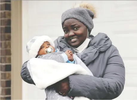  ?? NICK BRANCACCIO ?? Claudia Nizigiyima­na and her son, Penuel, are starting a new life in Canada after Claudia arrived from Burundi in February. The new mother said she is grateful for the housing and parenting skills taught by staff at the Our Lady of Guadalupe Home.