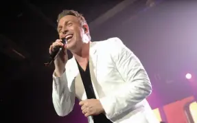  ?? CITIZEN FILE PHOTO ?? Johnny Reid, seen here performing at CN Centre in 2012, will bring his 14-piece band back to Prince George March 8.