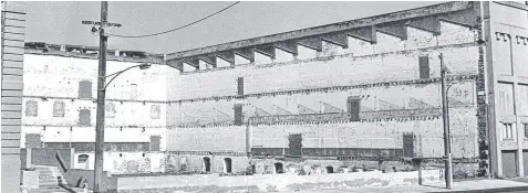  ??  ?? Above: The Bow Truss Building laid bare following the demolition of the adjacent Dennys Lascelles wool store in Brougham St in 1988.