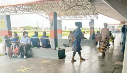  ??  ?? Some of the stranded passengers at Ilorin Airport whose flights were reschedule­d as a result of the incident