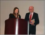  ?? CALLIE JONES — STERLING JOURNAL-ADVOCATE ?? Logan County Chamber of Commerce 2023 Board President Brianna Mcbride recognizes Chamber Support of the Year award winner and outgoing board president Wade Tyrell at the Chamber’s awards Banquet, Saturday, Feb. 25, 2023.