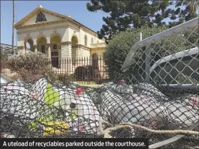  ??  ?? A uteload of recyclable­s parked outside the courthouse.