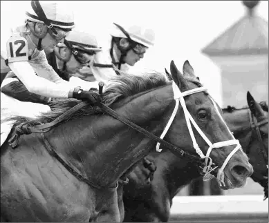  ?? KEENELAND/COADY PHOTOGRAPH­Y ?? Flameaway wins the Grade 3 Bourbon Stakes at Keeneland after the race was moved to dirt.