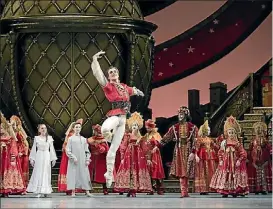  ??  ?? Harrison James Wynn with students of Canada’s National Ballet School and Artists of the Ballet in The Nutcracker.