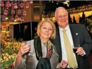  ??  ?? Carole and Turk Thacher of Devon raise a toast to PHS, the show’s entrants, suppliers, purveyors and opening night’s guests for the fabulous flower show.