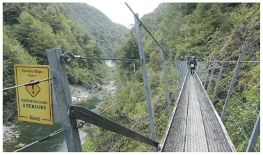  ?? ?? One of the Mōkihinui Gorge Suicide Slips – a bridge over a troublesom­e hillside.