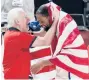  ?? LUCA BRUNO/AP ?? Kevin Durant celebrates a gold medal with U.S. head coach Gregg Popovich on Saturday.