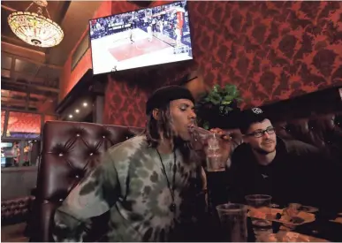  ?? JEFF CHIU/AP ?? Xavier Baskervill­e (left) smokes marijuana next to Rick Thompson in the smoking lounge at Barbary Coast Dispensary in San Francisco. San Francisco plans to issue more permits for marijuana smoking lounges this year after health officials finalize...