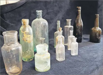  ?? NATASHA RICHARD/FOR TC MEDIA ?? These are some of the bottles found on Nancy Allen’s property during an excavation in October 2015. The bottles date back to the late 1800s, prior to the constructi­on of her home in 1904. She has given them to the Cumberland County Museum.